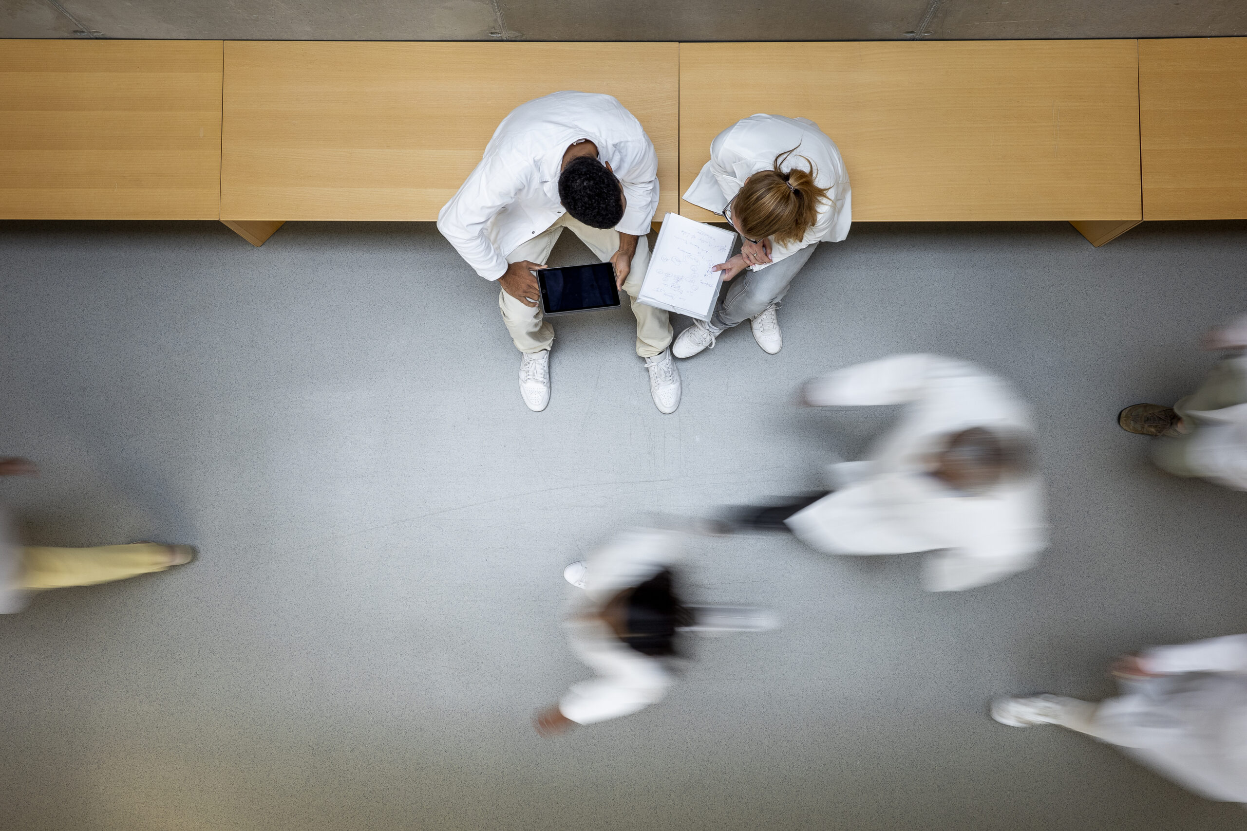 Scientists Walking In Corridor